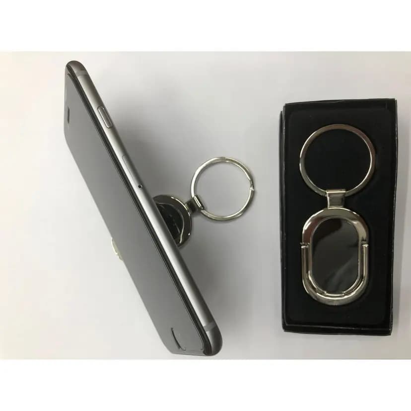 promosyon iki gümüş metal telefon tutucu, biri siyah kutuda, biri gri telefon arkasında